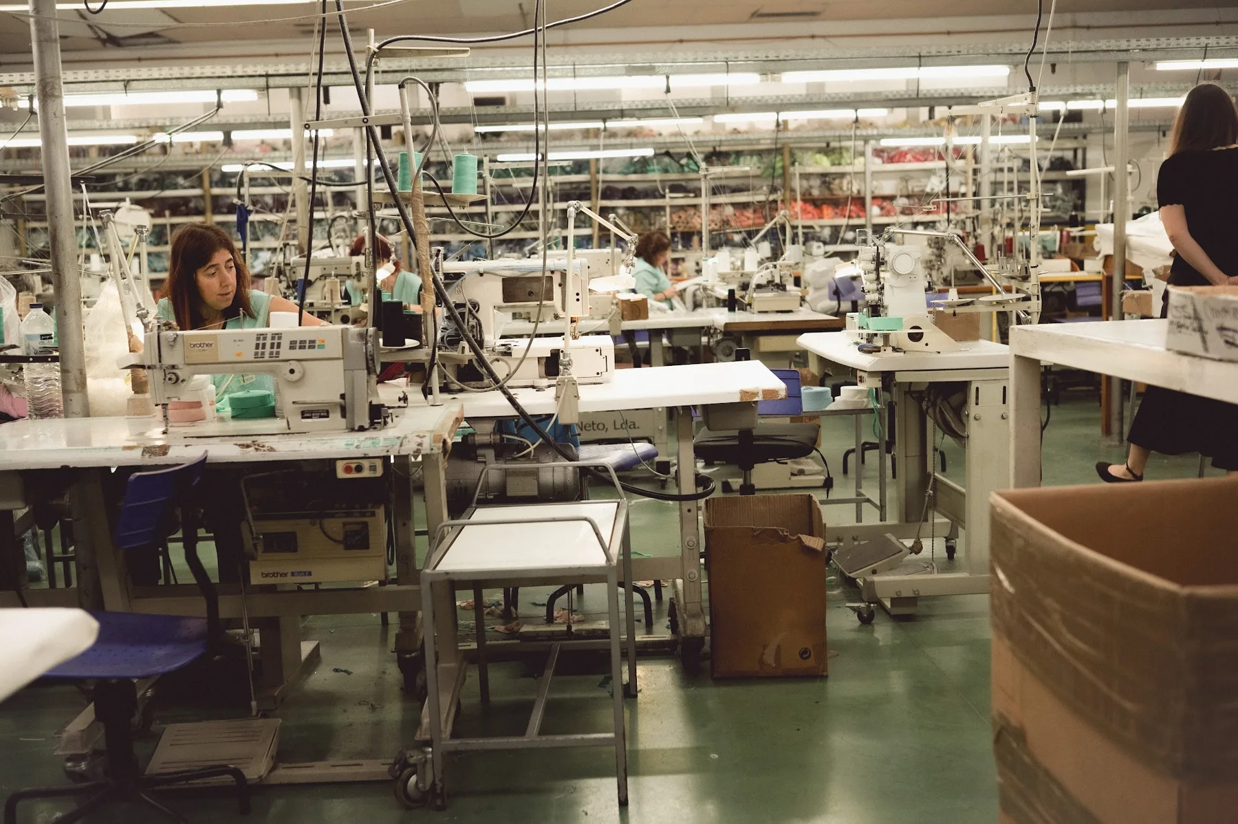 Garment production floor with workstations and sewing machines in Portugal